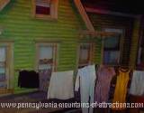 photo taken of reproduction of a typical house in Altoona in the 1950s with clothes hanging on a clothesline at ghost hunt at the Altoona Railroaders Memorial Museum