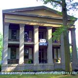 The main entrance view of Baker Mansion