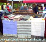 crafter at rug loom making rugs