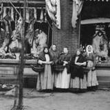 immigrant women standing in front of a butchershop at PA Museum