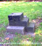 Cement steps to mount horse and horse hitch used for guests at Baker Mansion