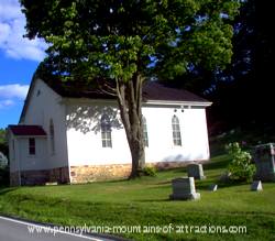 photo of the little white church home to bat colonly at Canoe Creek State Park
