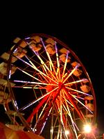 Ferris wheel light up at night at Bedford Fair 