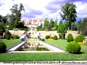 Limestone castle, known as Immergrun, and the reflecting pond in the Sunken Gardens