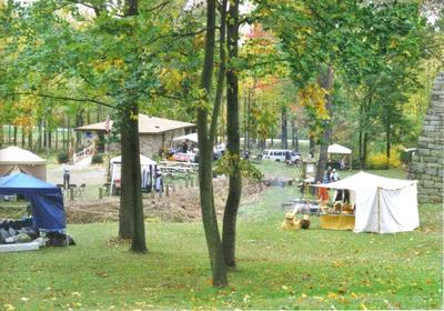 vendor tents in a wooded setting