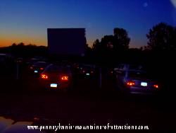 ghostly energy orbs floating through Carroltown drive-in theater