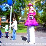 Cowgirl walking around on stilts at PA Arts and Crafts Festival