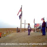 visitors looking out to the Flight 93 Memorial field where the plane crashed