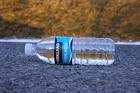 photo of a water bottle laid on Gravity Hill to prove it's level