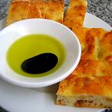 A photo of Italian bread with bowl of olive oil and balsmaic vinegar at Italian Food and Heritage Festival