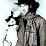 A photo of James Stewart holding a rabbit