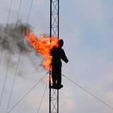 photo of a high wire act with a man on fire at Kennywood Park