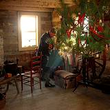 photo of a log home decorated at Old Bedford Village Colonial Christmas event