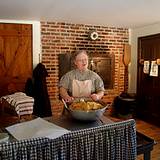 photo of a woman making old fashioned sugar cookies at Old Bedford Village Colonial Christmas event