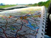 picture of holding a PA road map while travelling down a PA Highway