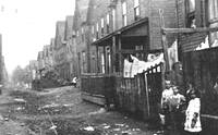 Johnstown PA Heritage Discovery Center - An old  rowhouse with immigrant children playing outdoors