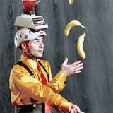 A juggler with bananas and a blender on his head, one part of entertainment at State College Central Pennsylvania Fetival of the Arts