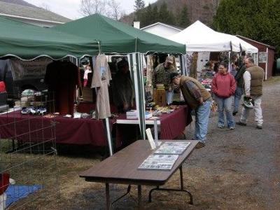 Vendors showcase goods and services for outdoor enthusiasts