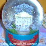 Snow globe of Baker Mansion celebrating 100th Year Anniversary of the Blair County Historical Society