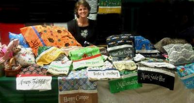 Mary Smith sells Handmade Pillowcases with embroidered  words & sayings on them, at the Morris Snake Hunt Flea Markets