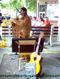 Native American playing flute at one of the Native American Pow Wows